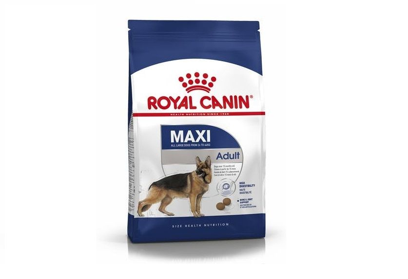 German Shepherd puppy sitting next to a puppy product pack