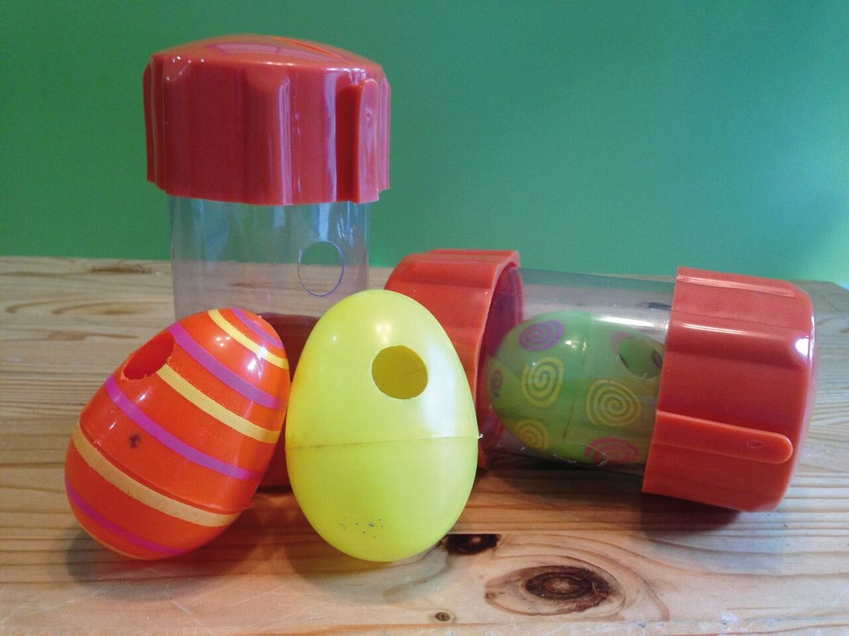 A commercially produced semi-transparent rolling puzzle. The cat can visualize the food, which is dispensed through three holes. Oval-shaped toys will roll eccentrically and can be more challenging for a cat to master. Further complexity can be introduced by using one toy inside another.