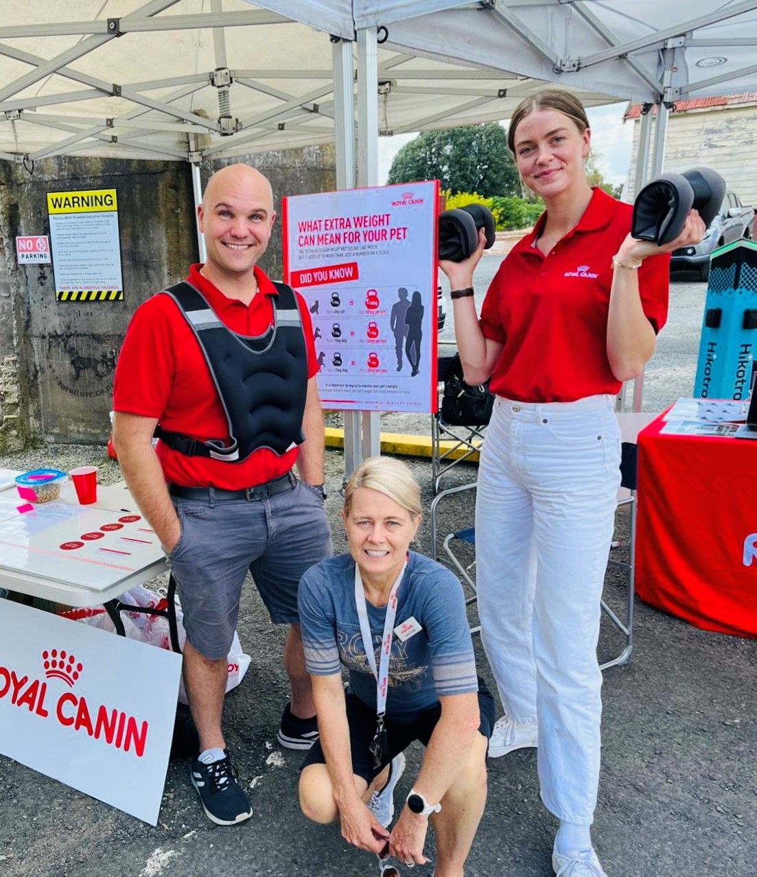 Royal Canin team standing in front of branded stall